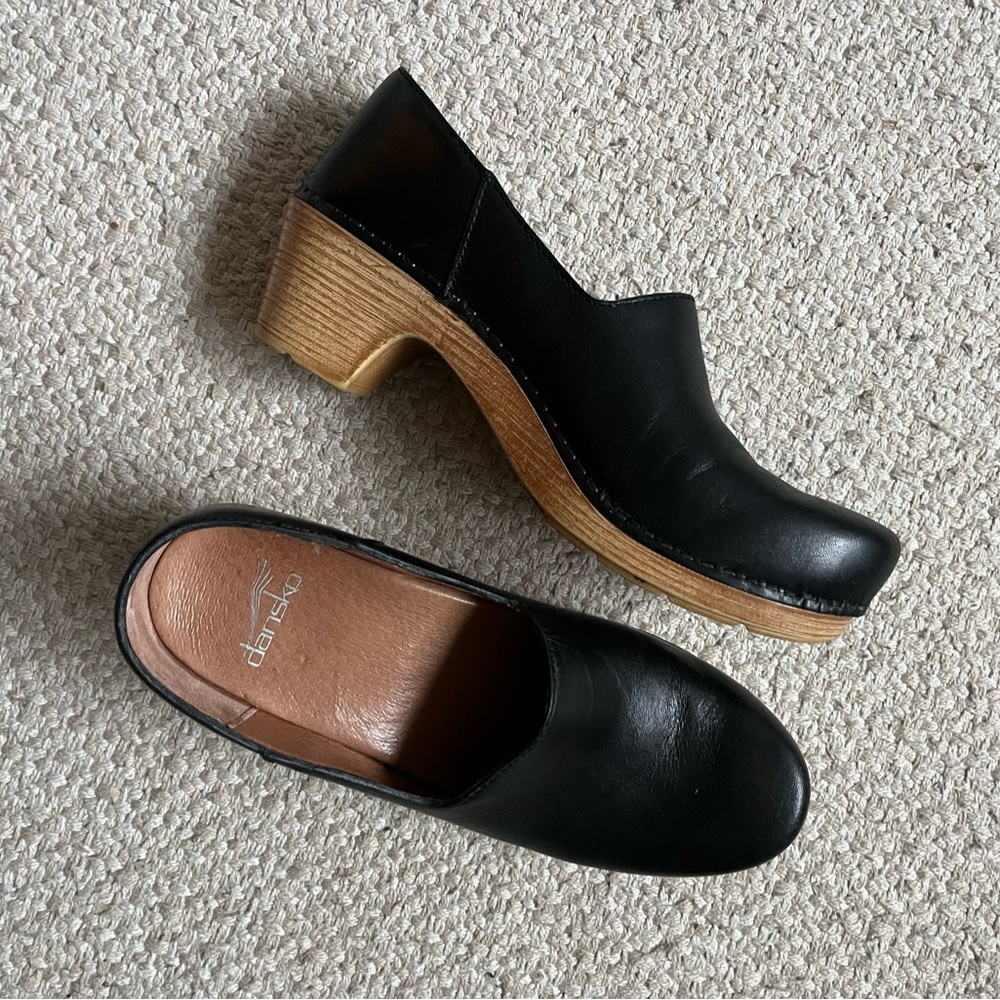 Dansko black leather clogs with tan sole
